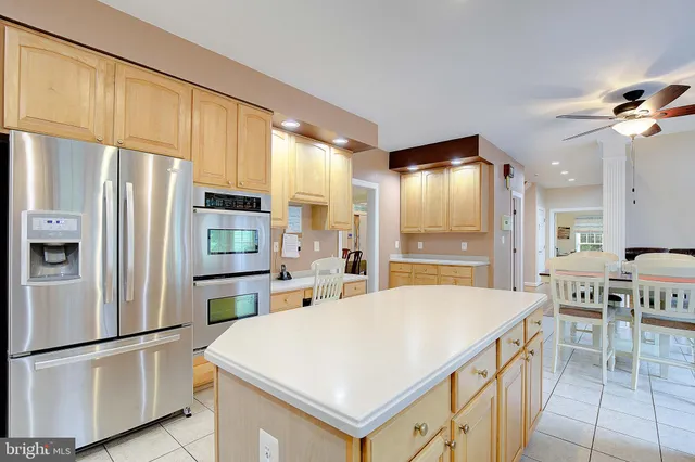 a bedroom with two beds and a chandelier