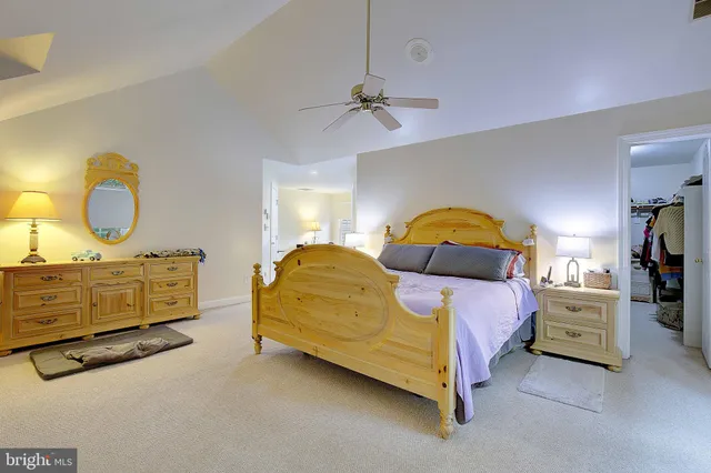 a kitchen with refrigerator and chairs