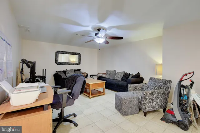 an aerial view of a house with backyard outdoor seating and green space