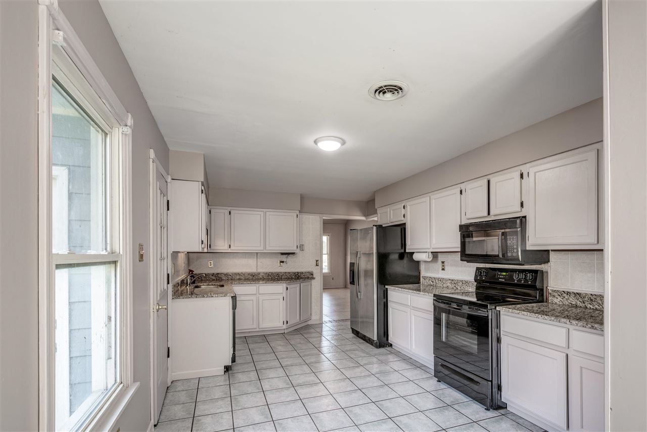 969 McQuiston Road Brighton, TN 38011 - Photo 8 of 25 a kitchen with stainless steel appliances a refrigerator sink and microwave