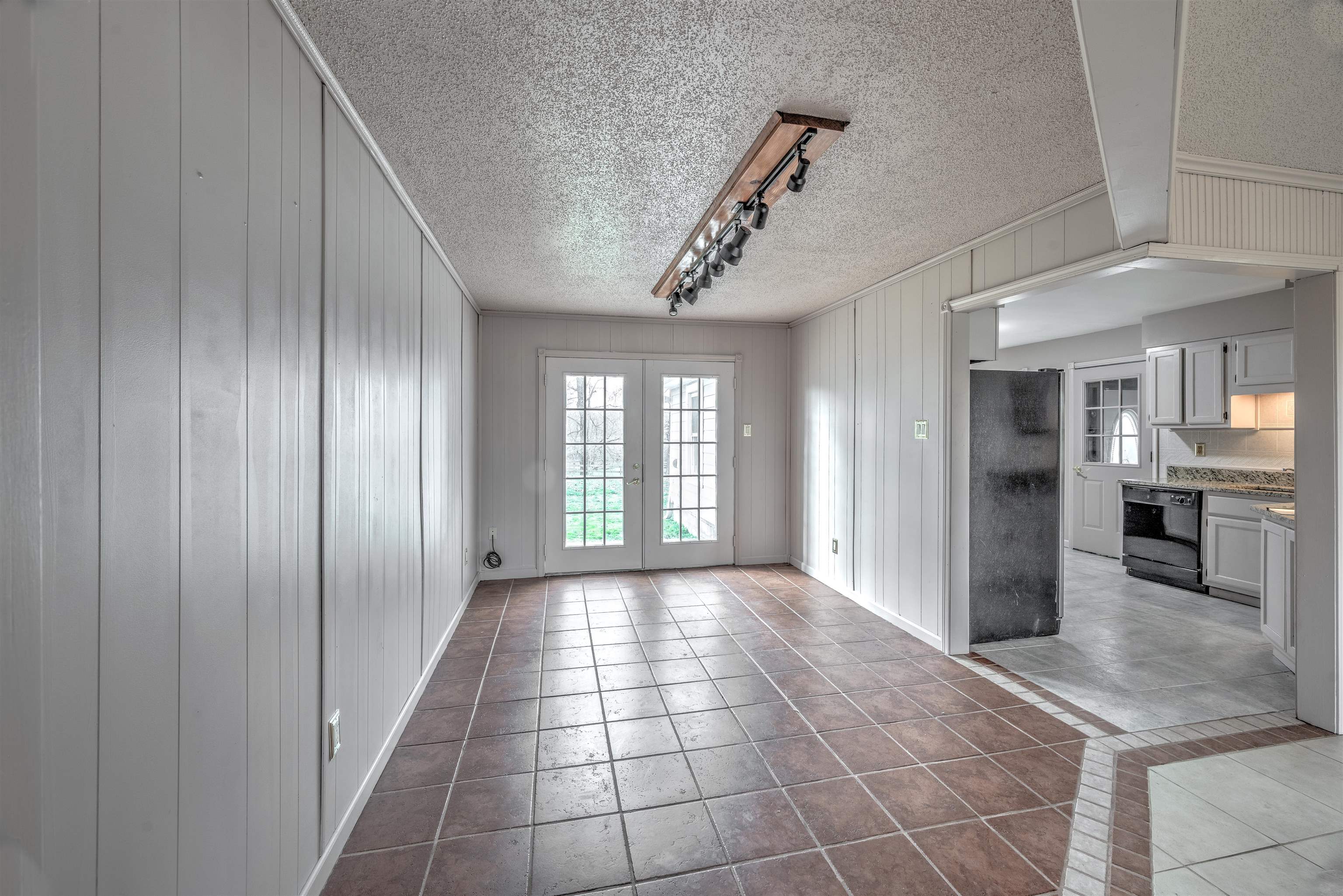 969 McQuiston Road Brighton, TN 38011 - Photo 10 of 25 a view of a hallway with wooden floor and a kitchen
