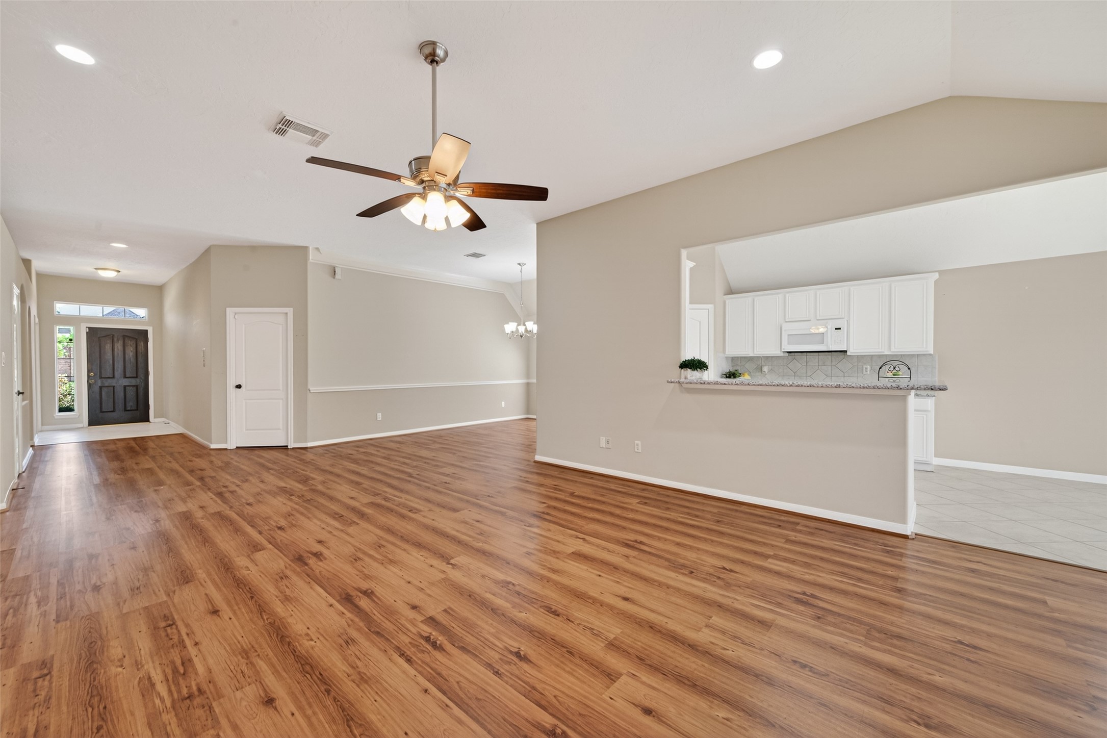 23211 Goldensong Court Spring, TX 77373 - Photo 15 of 50 Living room view to front door. Look how wide this entry is.