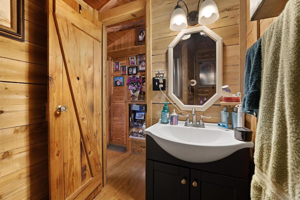 642 Earl Road Sadler, TX 76264 - Photo 24 of 40 a bathroom with a sink a mirror and shower