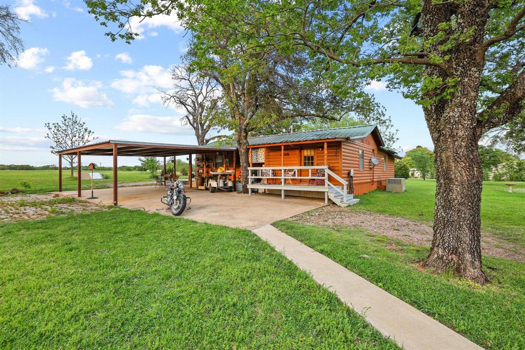 642 Earl Road Sadler, TX 76264 - Photo 27 of 40 a view of a house with backyard porch and sitting area