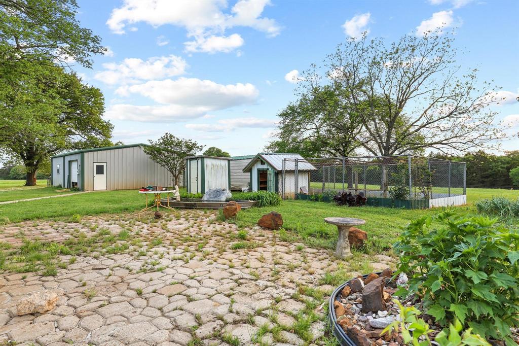 642 Earl Road Sadler, TX 76264 - Photo 28 of 40 a view of a house with a yard