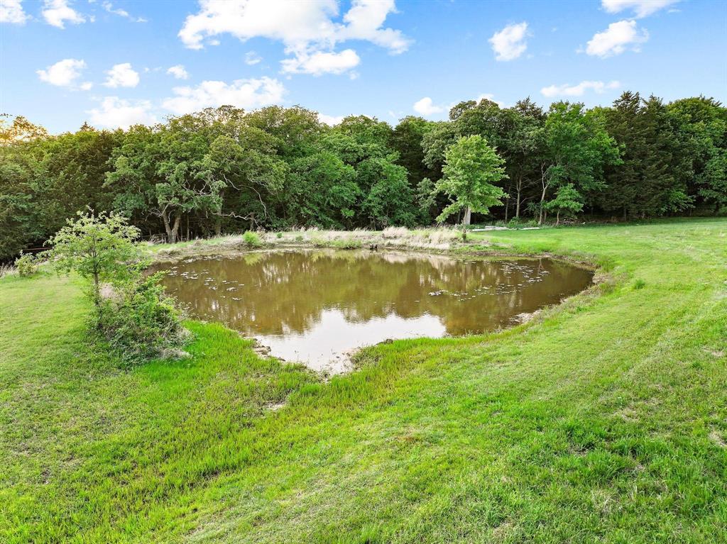 642 Earl Road Sadler, TX 76264 - Photo 30 of 40 a view of a lake with a yard