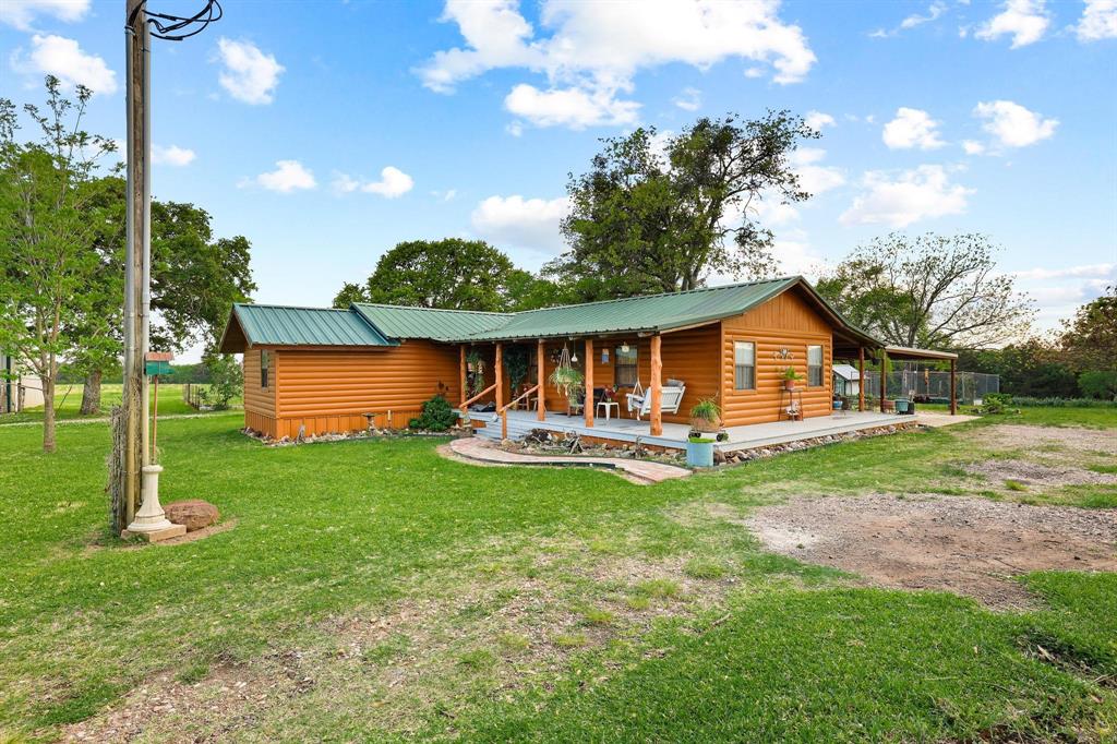 642 Earl Road Sadler, TX 76264 - Photo 3 of 40 a front view of a house with yard and green space