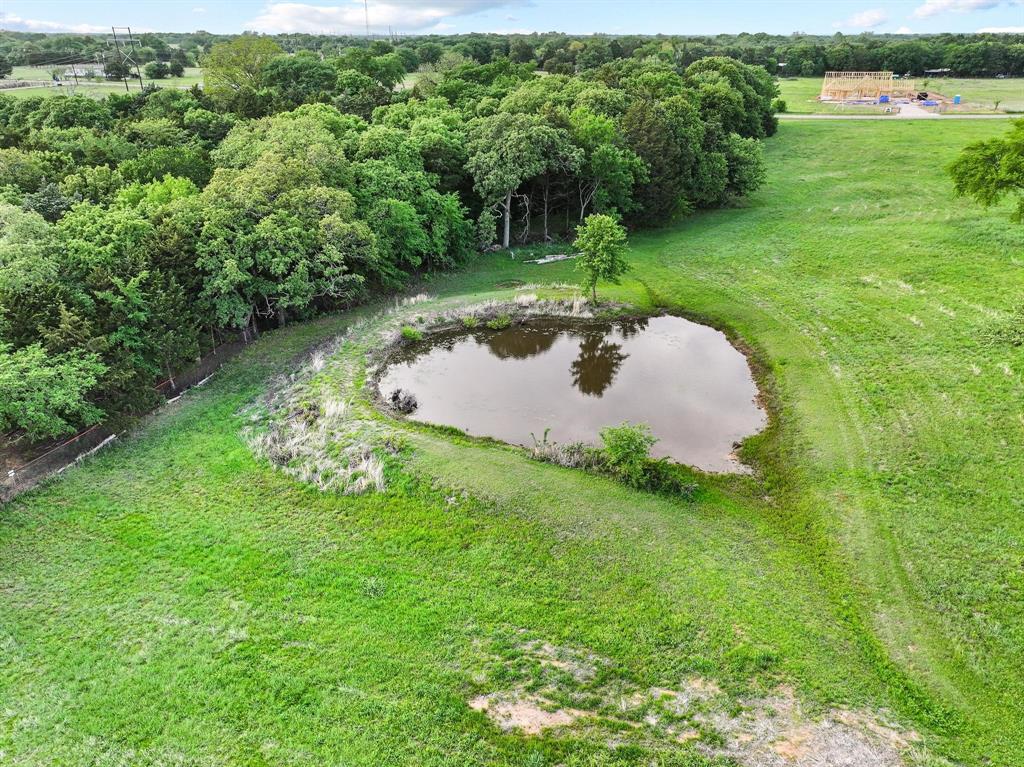 642 Earl Road Sadler, TX 76264 - Photo 31 of 40 a backyard of a house with a yard and lake view