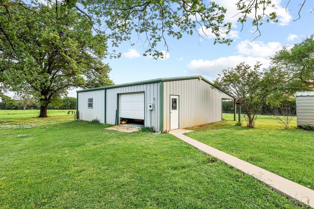 642 Earl Road Sadler, TX 76264 - Photo 34 of 40 a view of a house with a back yard