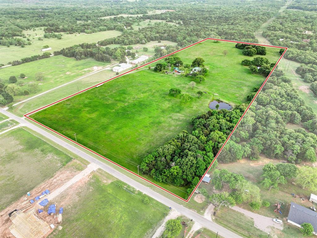 642 Earl Road Sadler, TX 76264 - Photo 35 of 40 a view of a green field with an outdoor space