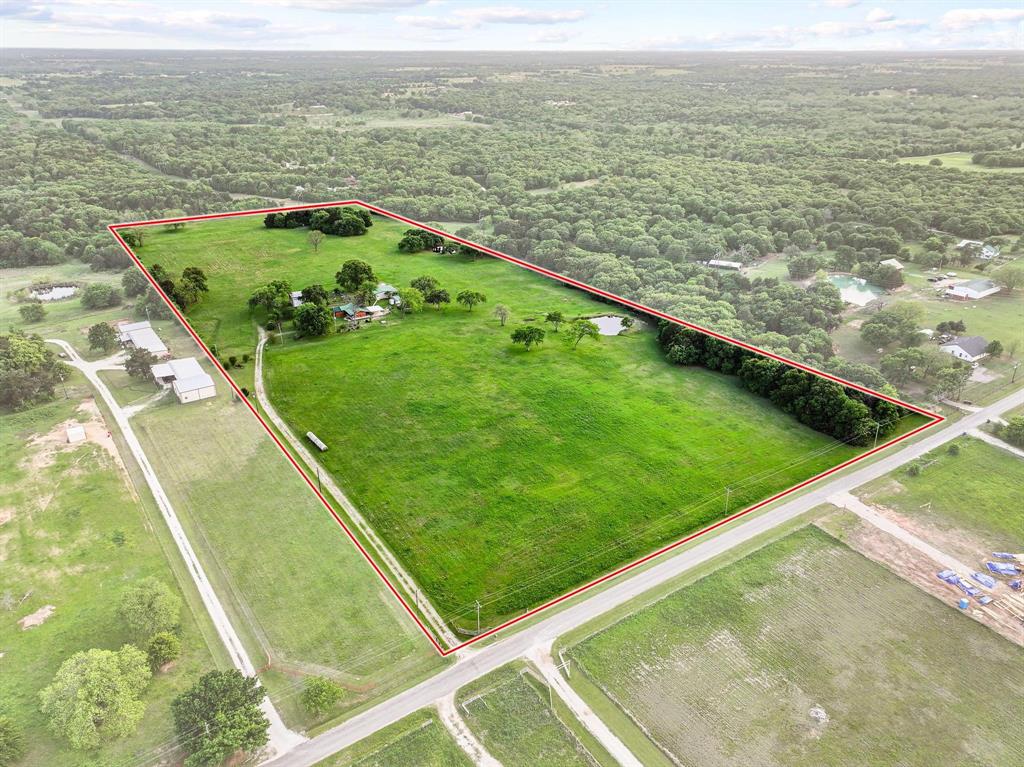 642 Earl Road Sadler, TX 76264 - Photo 36 of 40 a view of a pool with lawn chairs and a big yard