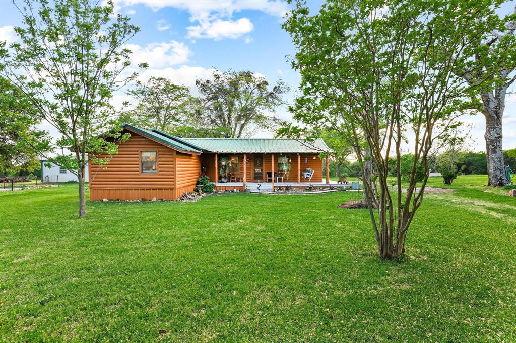 642 Earl Road Sadler, TX 76264 - Photo 4 of 40 a front view of a house with yard and green space