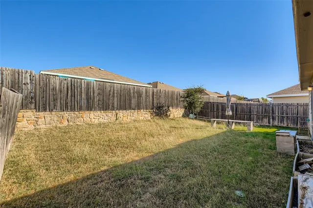 a view of swimming pool with a yard