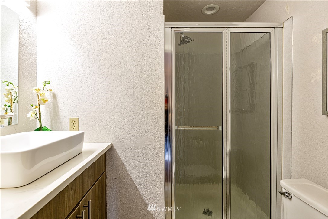 1908 Northeast 19th Place Renton, WA 98056 - Photo 14 of 23 a bathroom with a shower and a sink