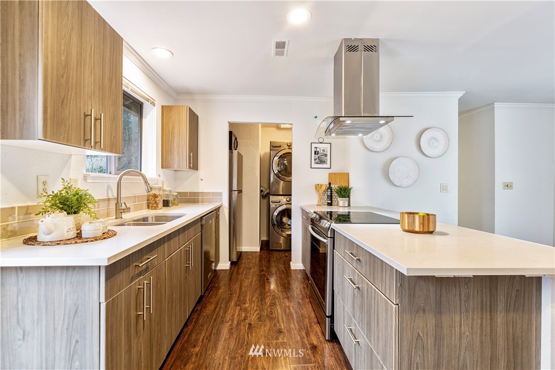 1908 Northeast 19th Place Renton, WA 98056 - Photo 5 of 23 a kitchen with a sink stove and cabinets