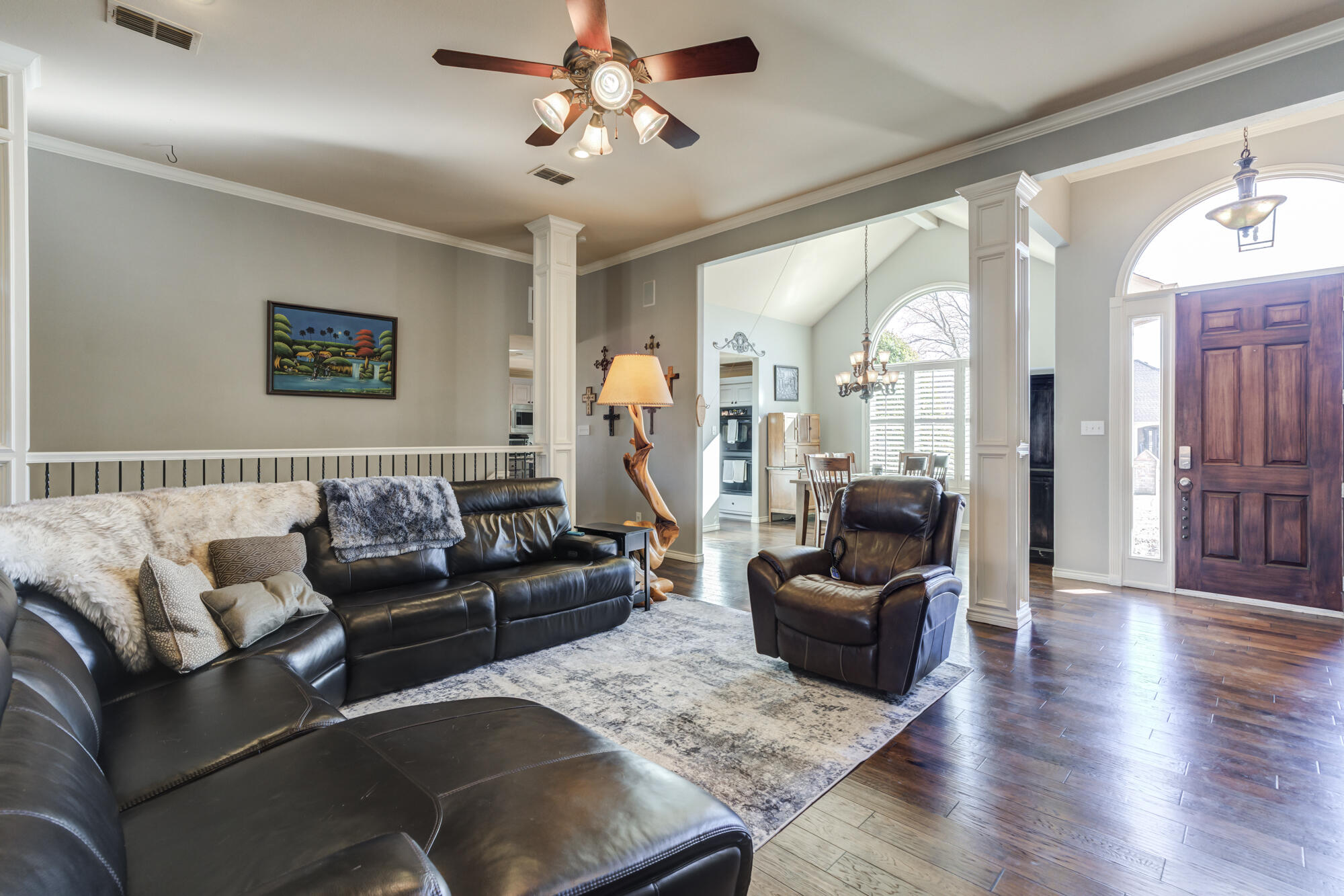 6302 County Road 7435 Lubbock, TX 79424 - Photo 11 of 59 a living room with furniture and a flat screen tv