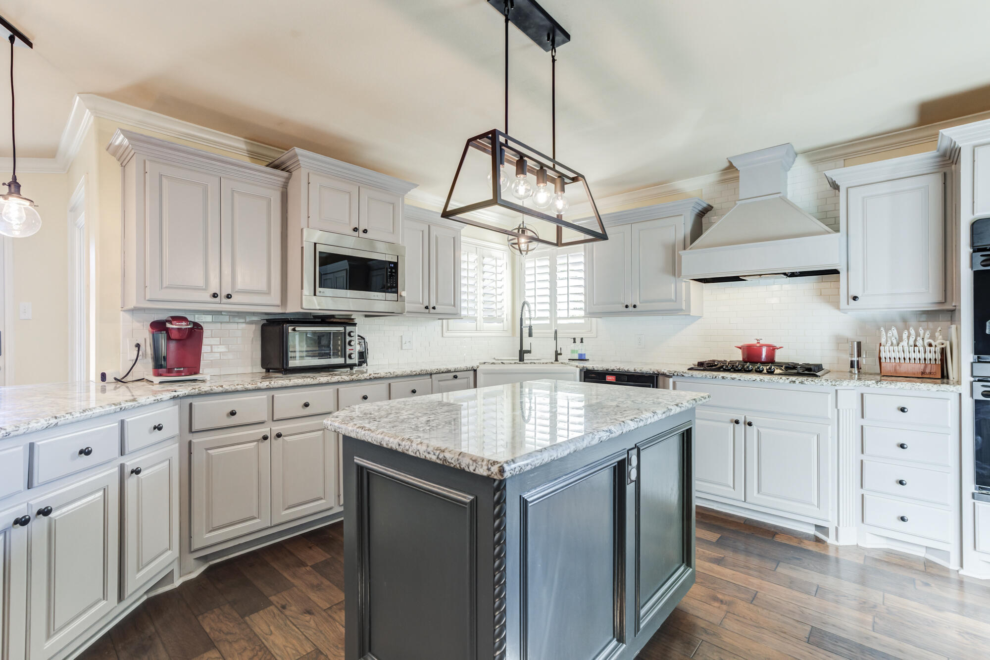6302 County Road 7435 Lubbock, TX 79424 - Photo 13 of 59 a kitchen with white cabinets and sink