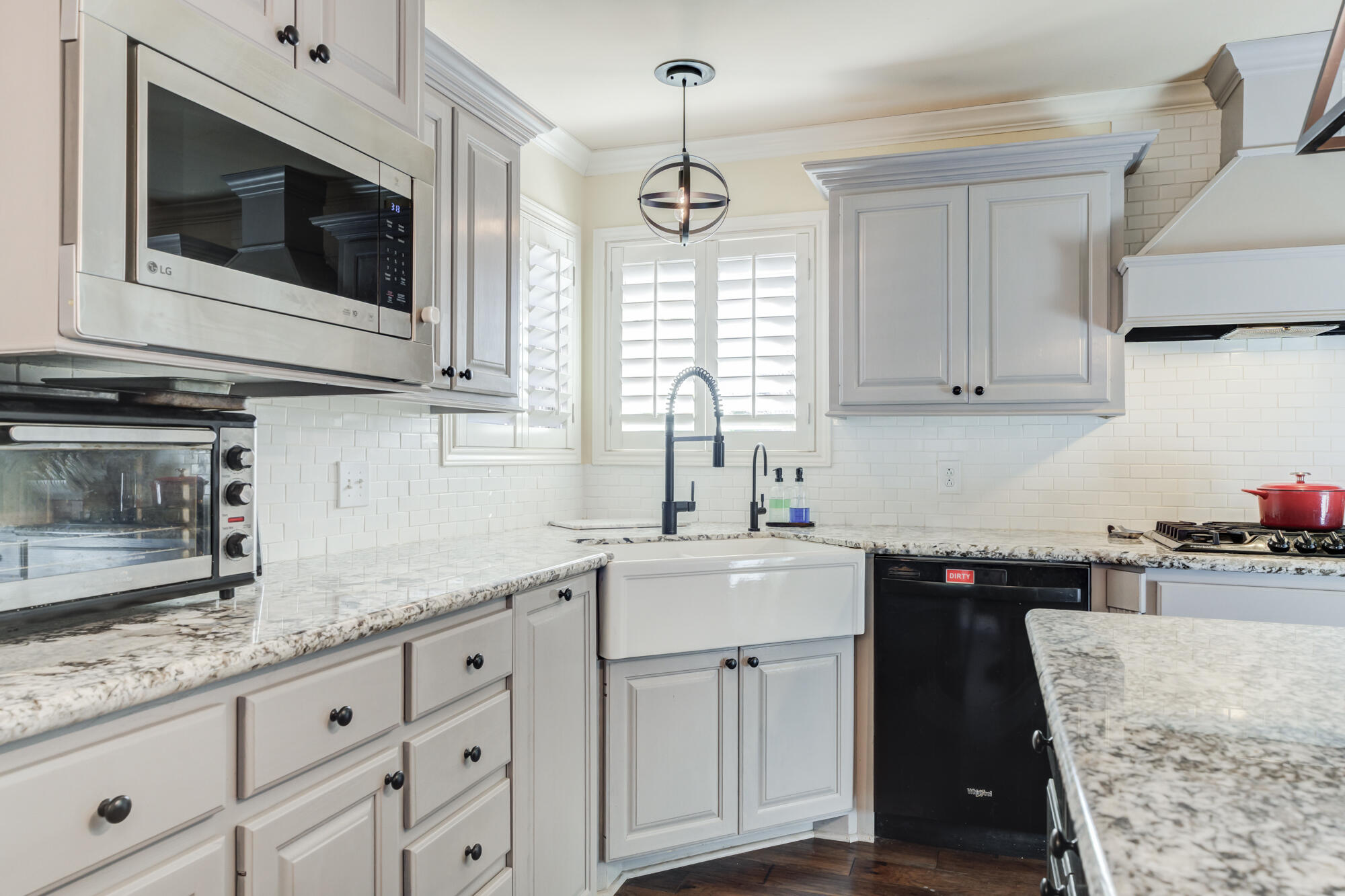 6302 County Road 7435 Lubbock, TX 79424 - Photo 15 of 59 a kitchen with stainless steel appliances granite countertop a sink stove and microwave