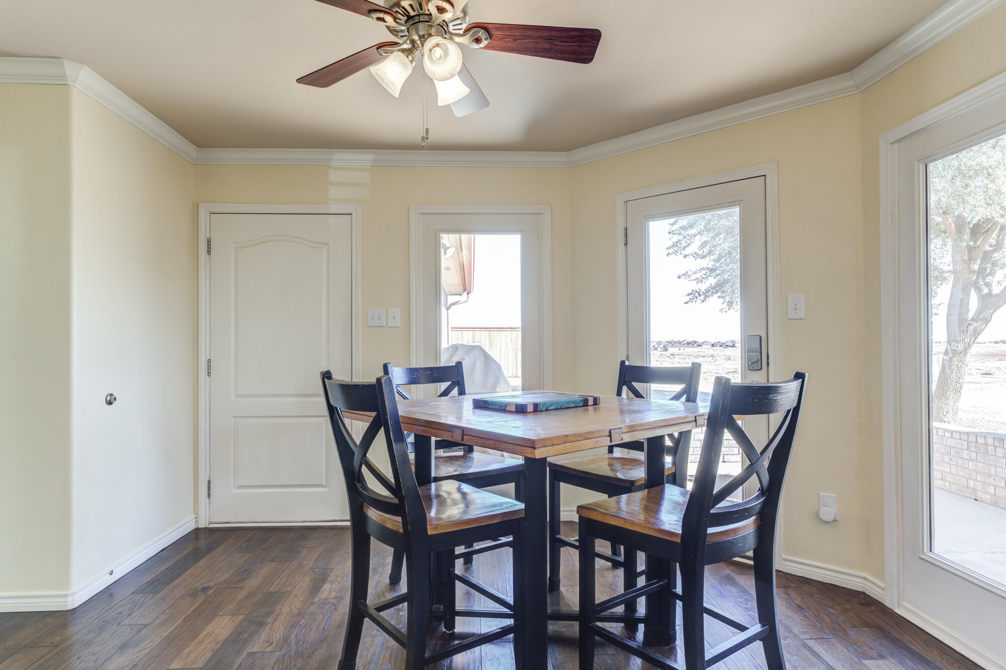 6302 County Road 7435 Lubbock, TX 79424 - Photo 19 of 59 a view of a dining room with furniture window and wooden floor