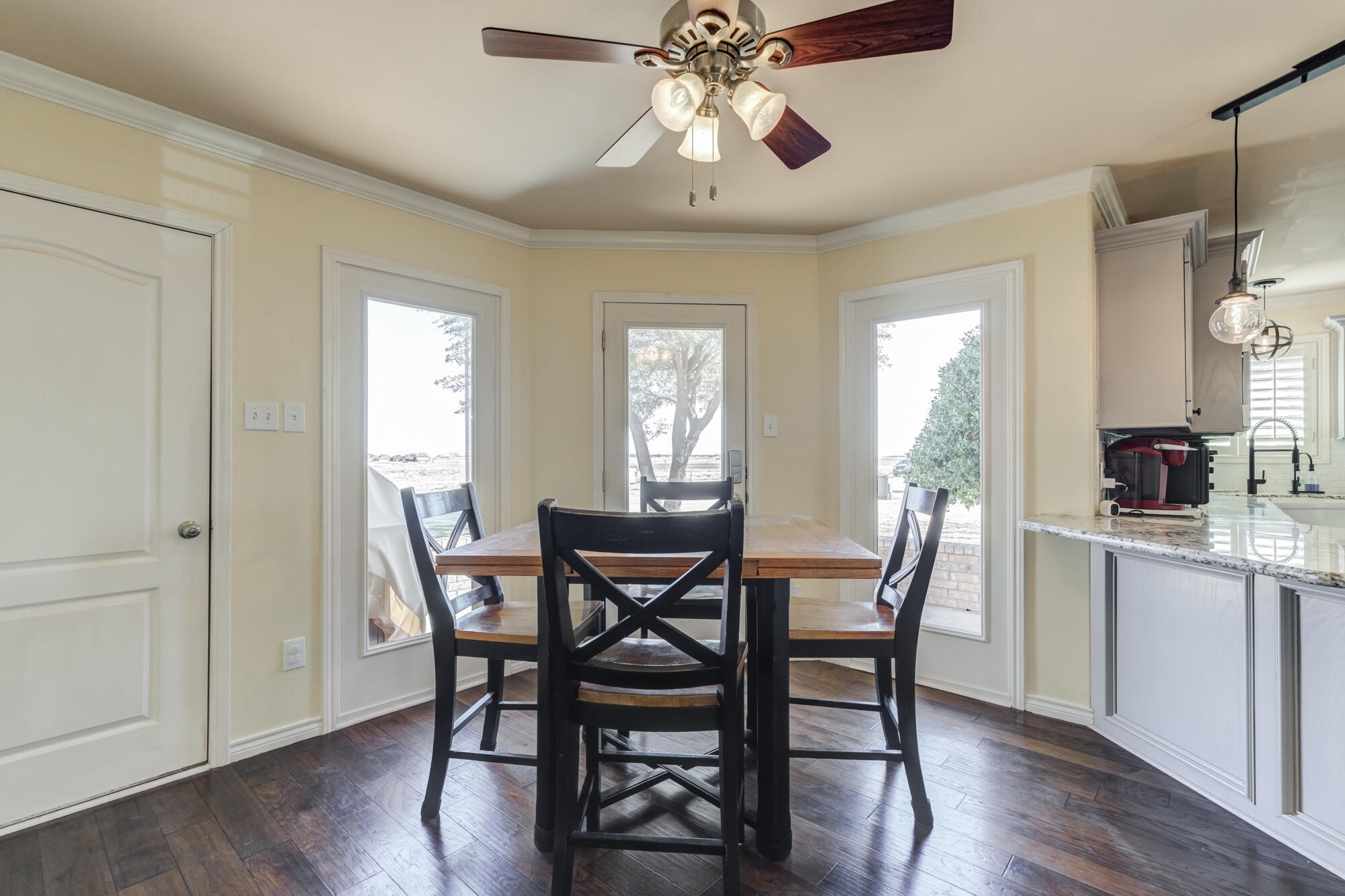 6302 County Road 7435 Lubbock, TX 79424 - Photo 20 of 59 a view of a dining room with furniture window and wooden floor