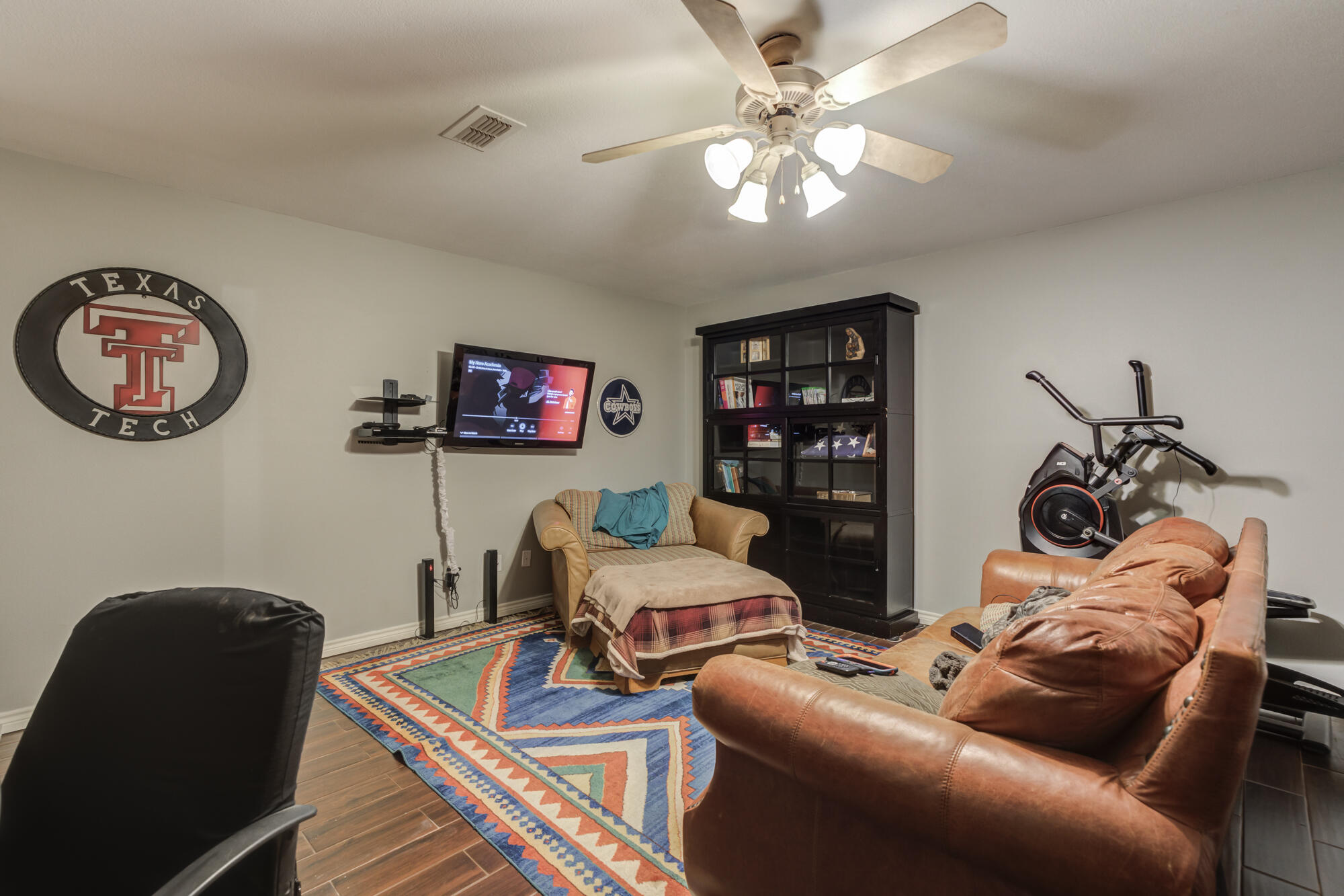 6302 County Road 7435 Lubbock, TX 79424 - Photo 24 of 59 a bedroom with furniture and a fan