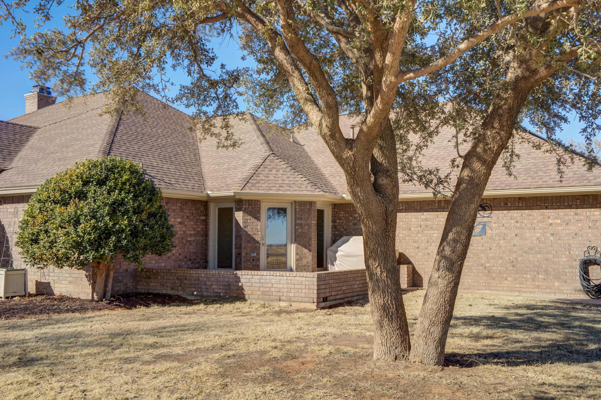 6302 County Road 7435 Lubbock, TX 79424 - Photo 3 of 59 a front view of a house with a yard