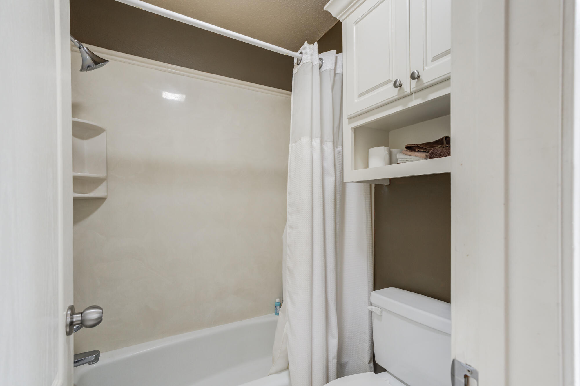 6302 County Road 7435 Lubbock, TX 79424 - Photo 35 of 59 a bathroom with a bathtub and a shower