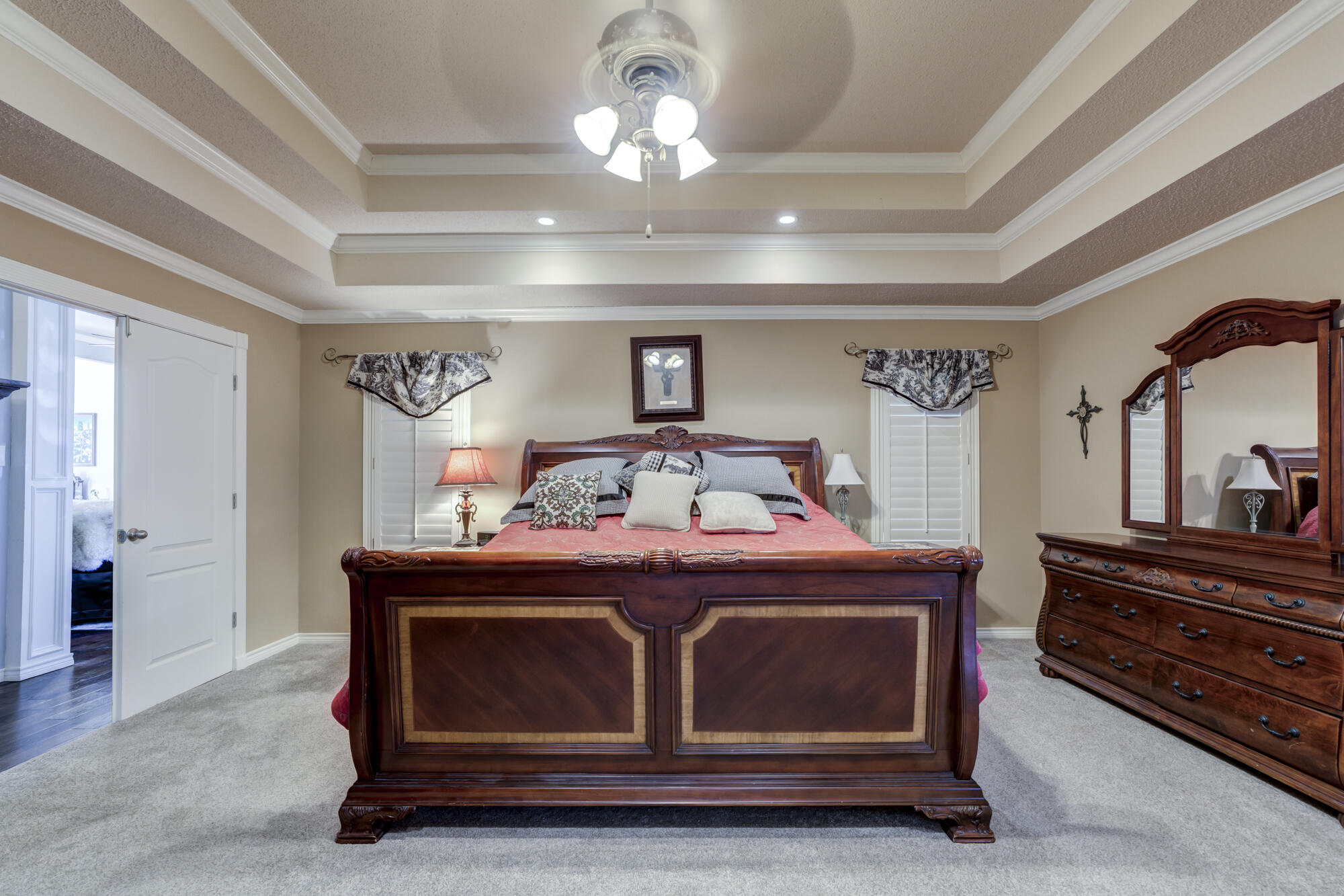 6302 County Road 7435 Lubbock, TX 79424 - Photo 38 of 59 a room with a bed and a chandelier