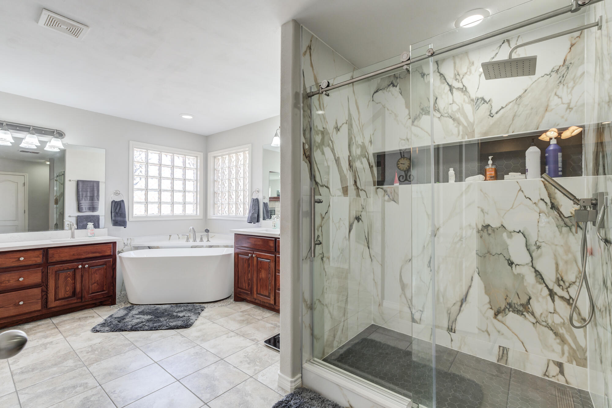 6302 County Road 7435 Lubbock, TX 79424 - Photo 39 of 59 a bathroom with a bathtub a sink and a shower