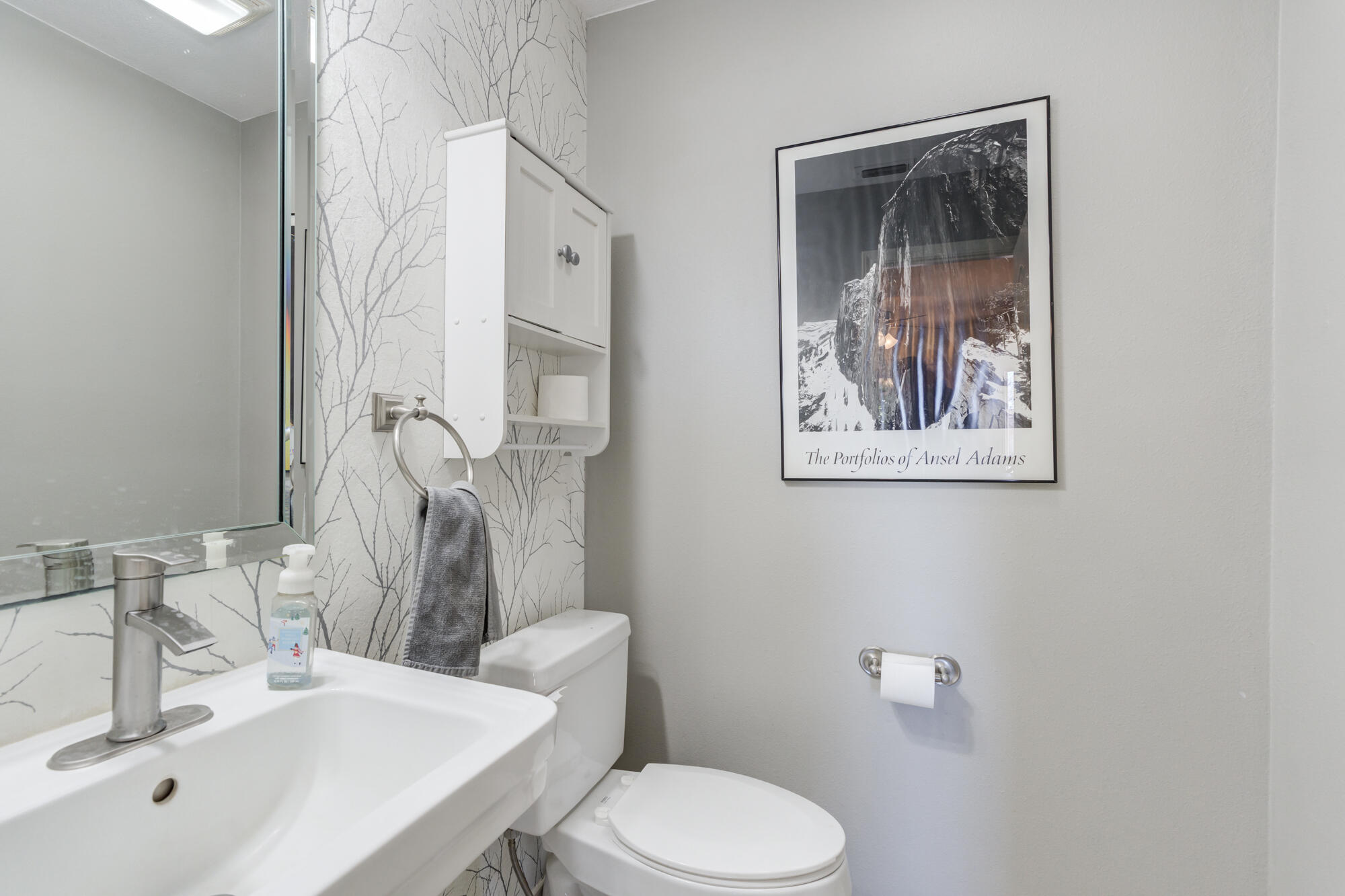6302 County Road 7435 Lubbock, TX 79424 - Photo 45 of 59 a bathroom with a toilet sink and mirror