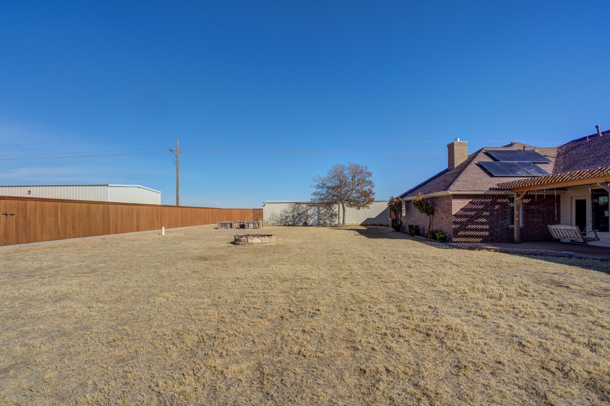 6302 County Road 7435 Lubbock, TX 79424 - Photo 51 of 59 a house with a wooden fence