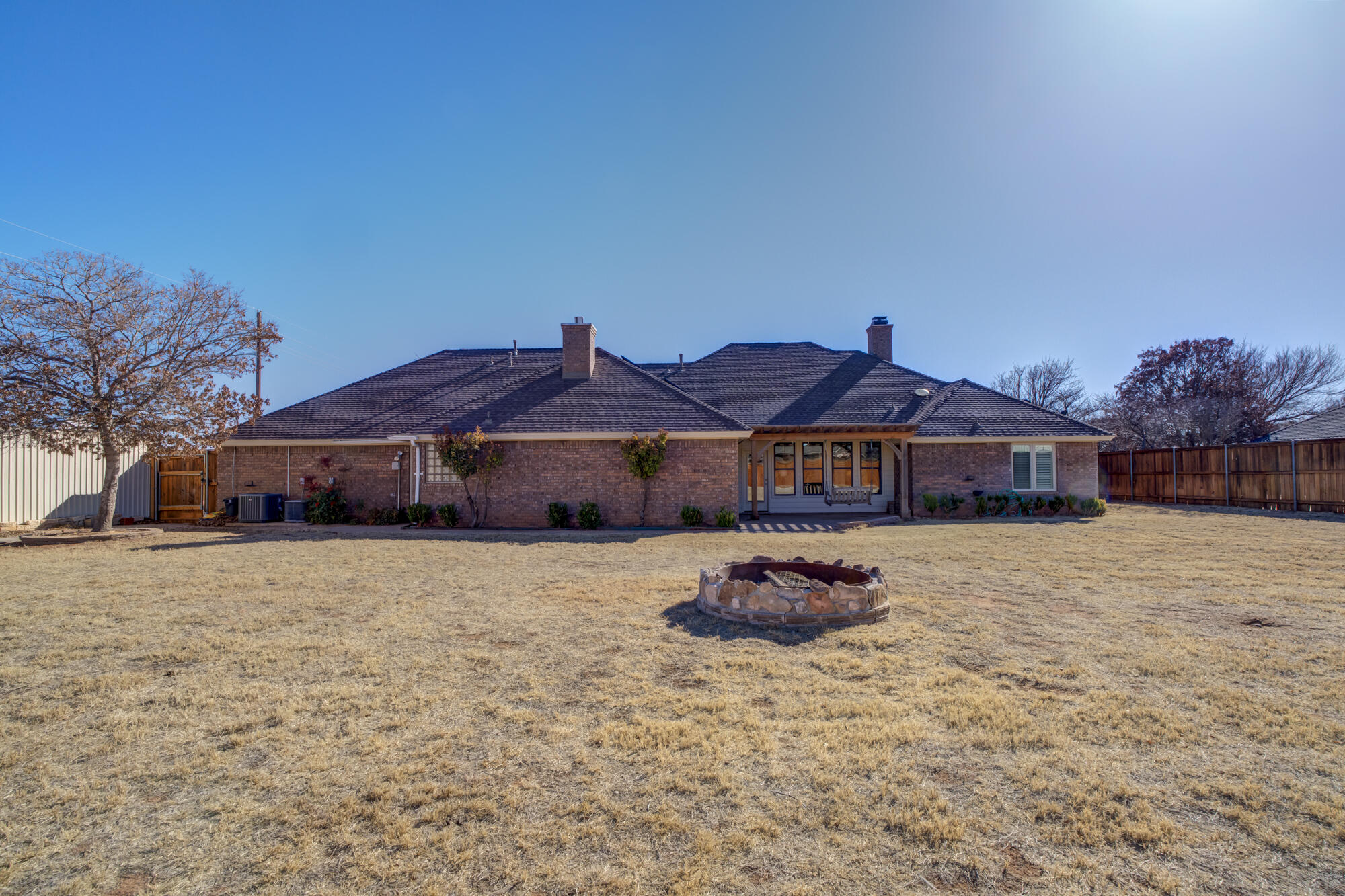 6302 County Road 7435 Lubbock, TX 79424 - Photo 53 of 59 a front view of a house with a yard