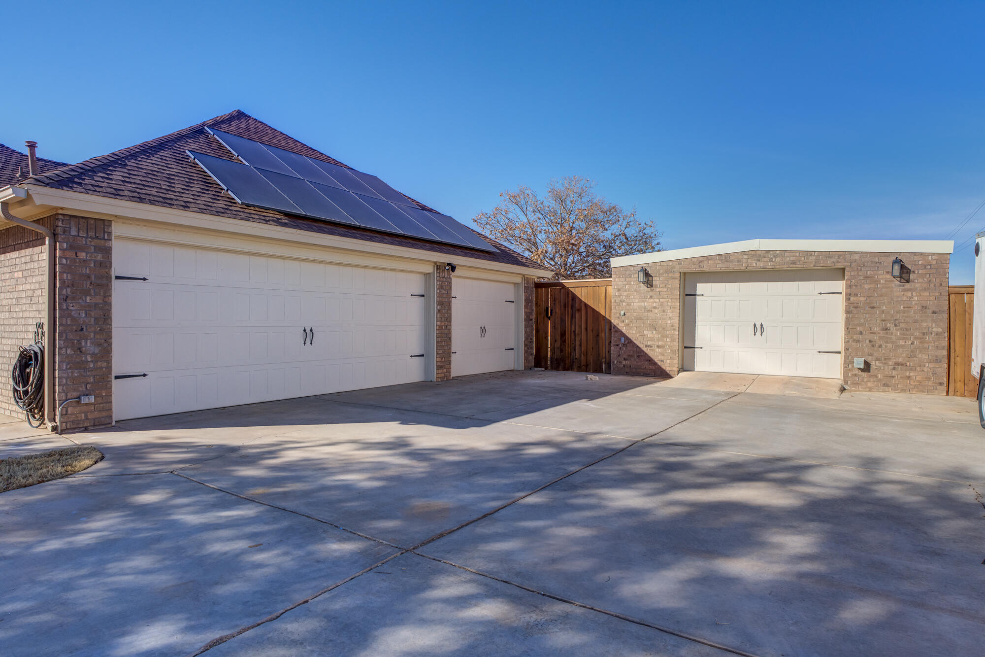 6302 County Road 7435 Lubbock, TX 79424 - Photo 58 of 59 a view of a house with a yard and garage