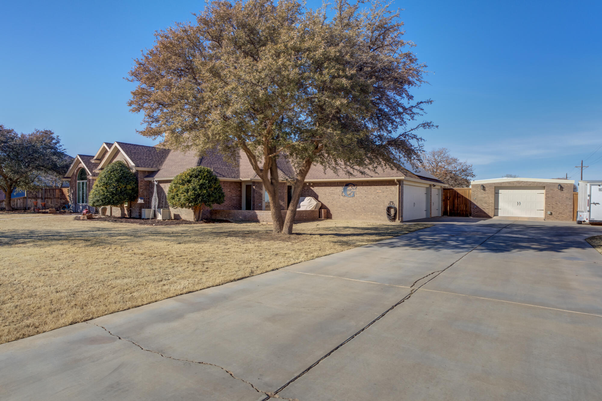 6302 County Road 7435 Lubbock, TX 79424 - Photo 59 of 59 a house with trees in front of it
