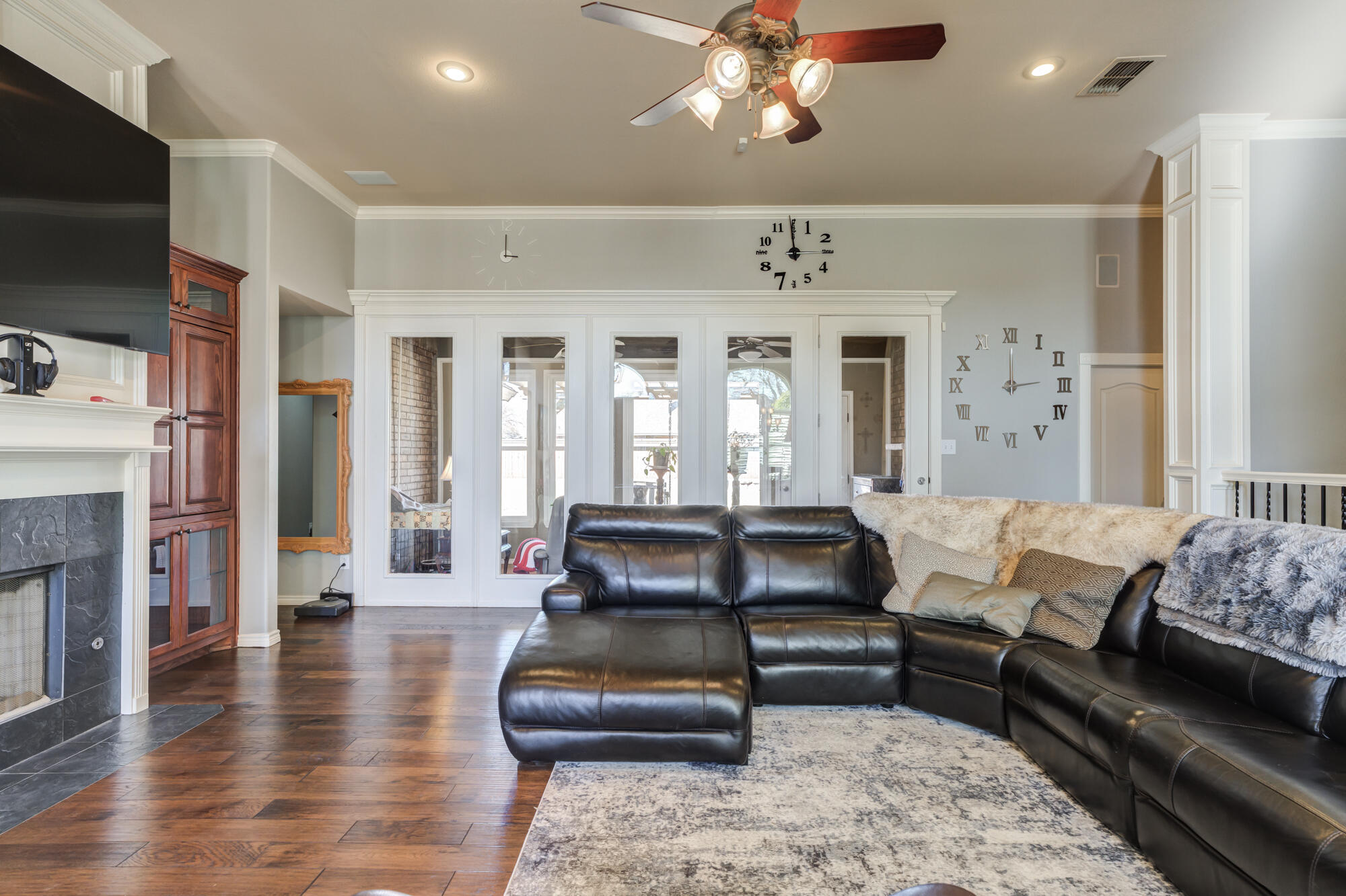 6302 County Road 7435 Lubbock, TX 79424 - Photo 8 of 59 a living room with furniture a flat screen tv and a fireplace
