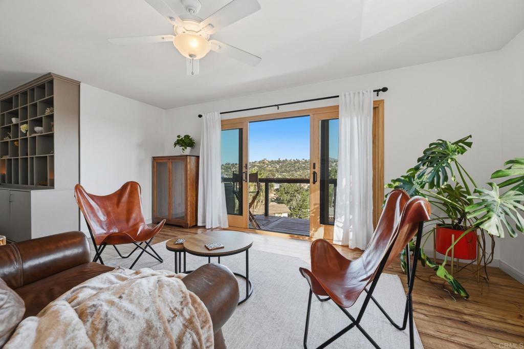 3328 Central Avenue Spring Valley, CA 91977 - Photo 12 of 54 a living room with furniture a lamp and a potted plant