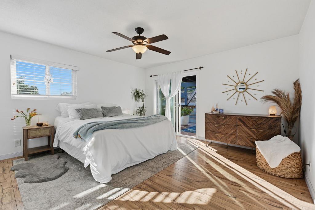 3328 Central Avenue Spring Valley, CA 91977 - Photo 23 of 54 a bedroom with a large bed and a chandelier