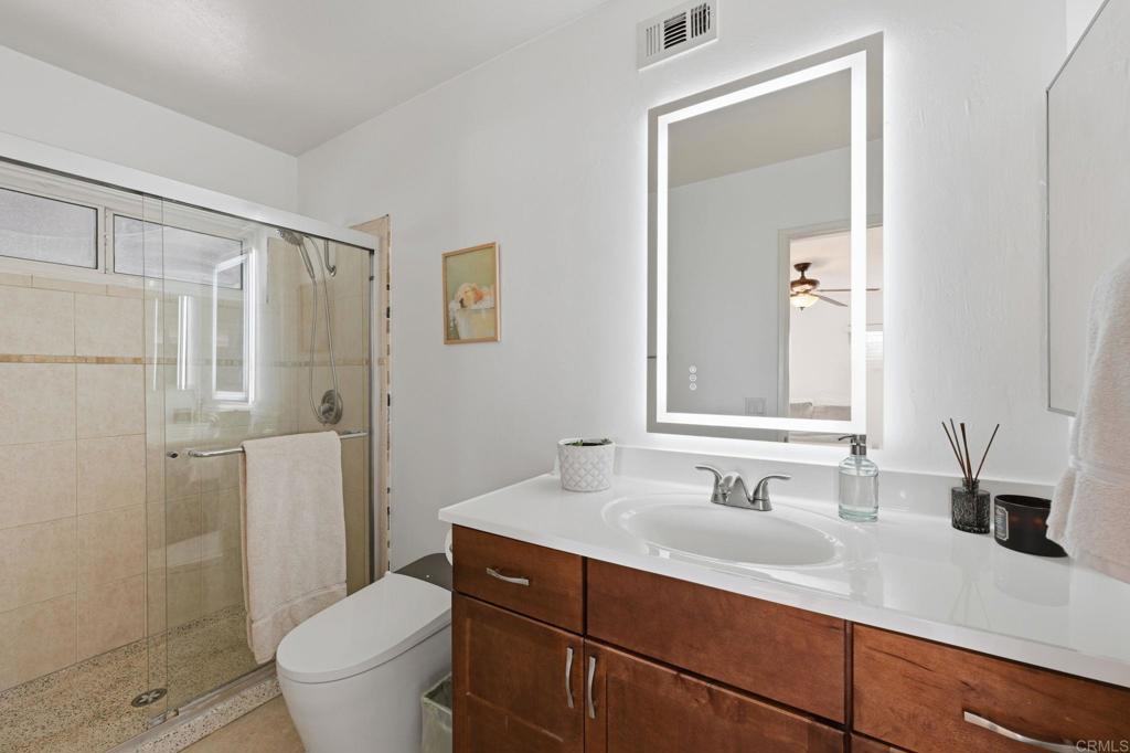 3328 Central Avenue Spring Valley, CA 91977 - Photo 26 of 54 a bathroom with a sink toilet double vanity and shower