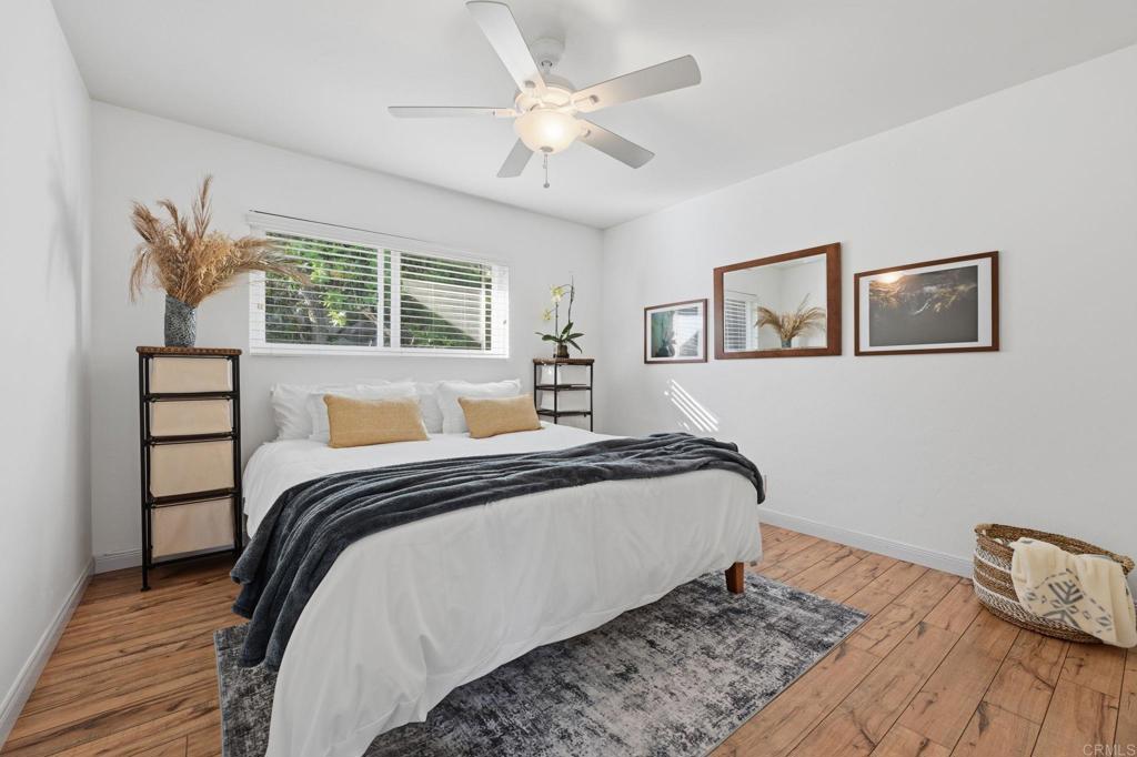 3328 Central Avenue Spring Valley, CA 91977 - Photo 27 of 54 a bedroom with a bed and wooden floor