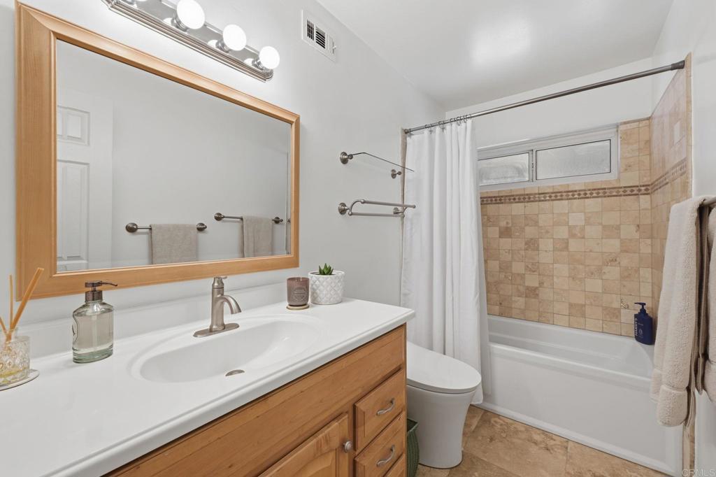 3328 Central Avenue Spring Valley, CA 91977 - Photo 28 of 54 a bathroom with a double vanity sink toilet and shower