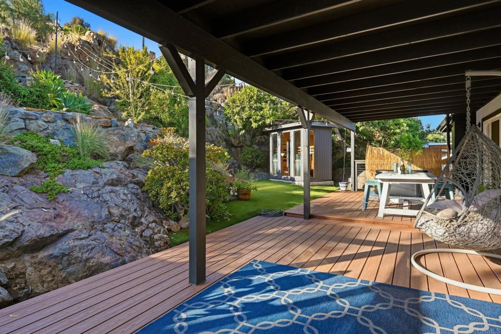 3328 Central Avenue Spring Valley, CA 91977 - Photo 36 of 54 a view of a patio with table and chairs potted plants with wooden floor and fence