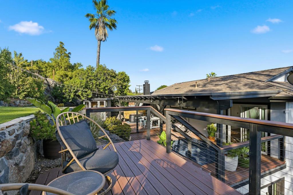 3328 Central Avenue Spring Valley, CA 91977 - Photo 39 of 54 a balcony of a house with wooden floor outdoor seating and barbeque oven