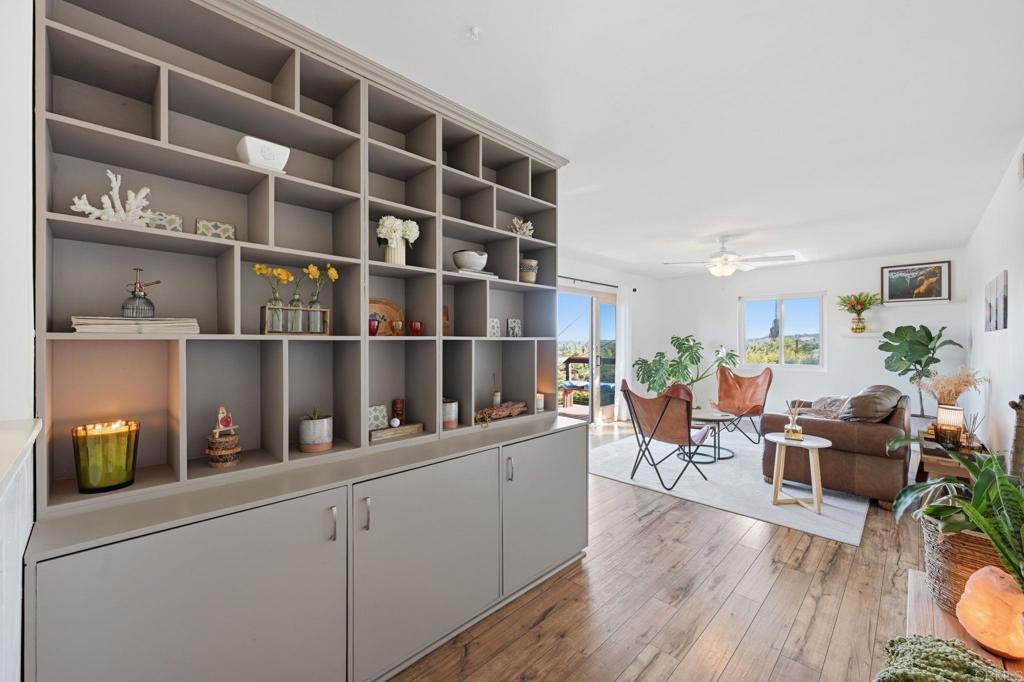 3328 Central Avenue Spring Valley, CA 91977 - Photo 10 of 54 a living room with furniture and a book shelf