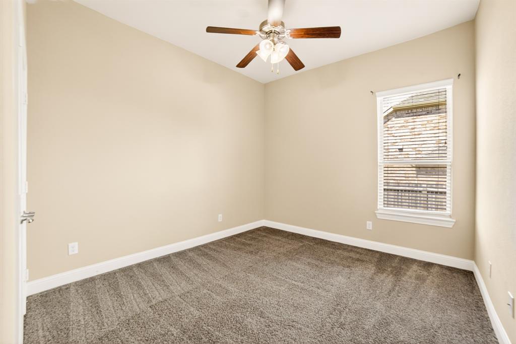 552 Winnetka Drive Oak Point, TX 75068 - Photo 10 of 40 an empty room with windows and fan