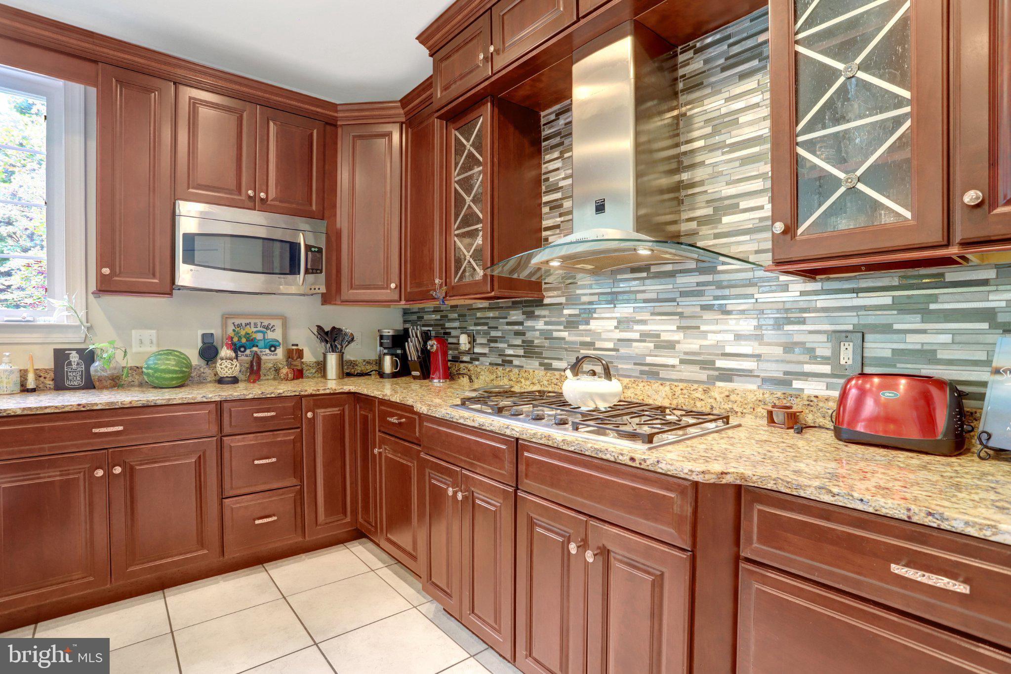 9219 Fort Foote Road Fort Washington, MD 20744 - Photo 10 of 68 Elegant kitchen with rich cabinetry.