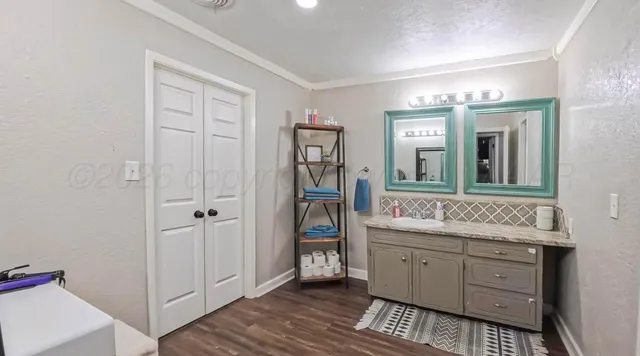 a bathroom with a sink and a mirror