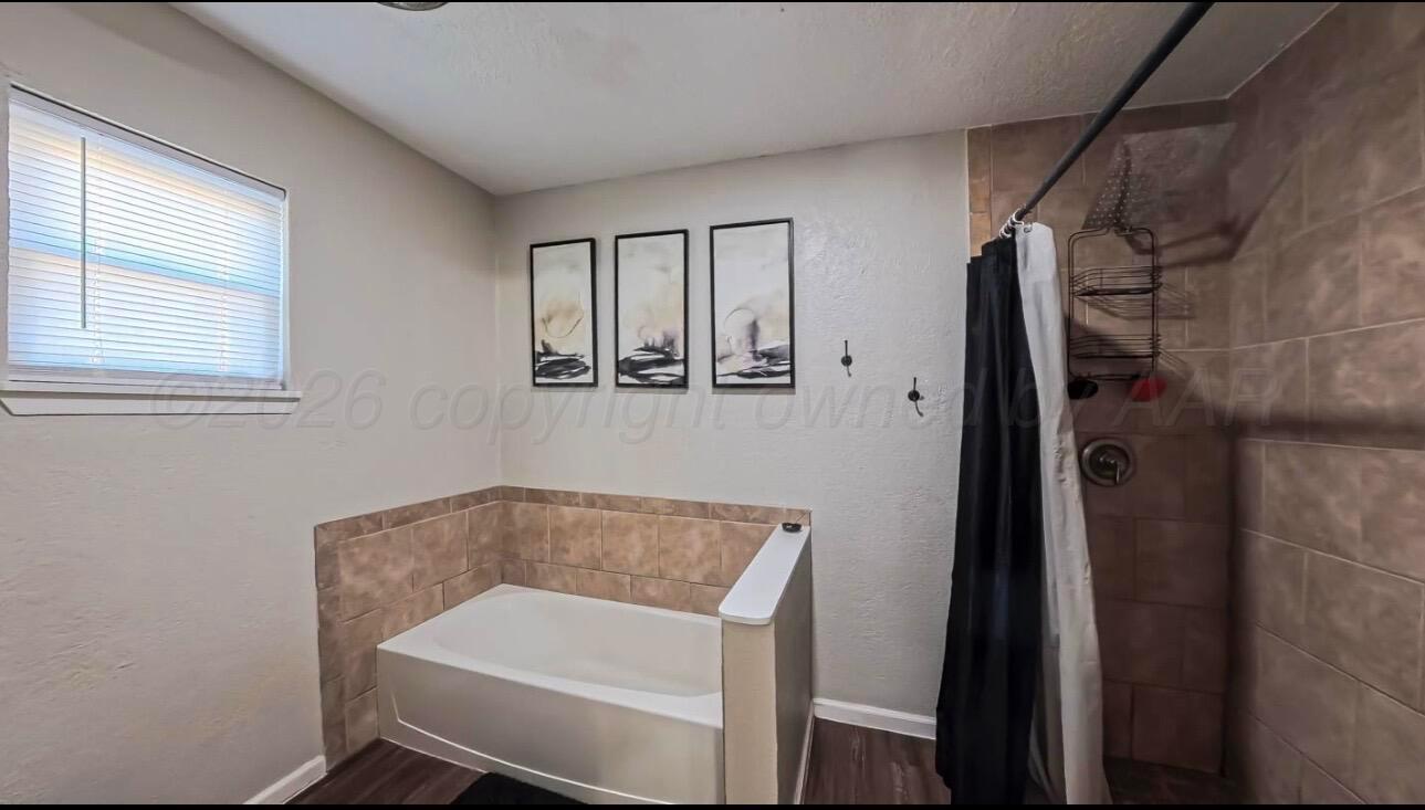 1402 Marigold Street Borger, TX 79007 - Photo 14 of 18 a bathroom with a sink and a mirror