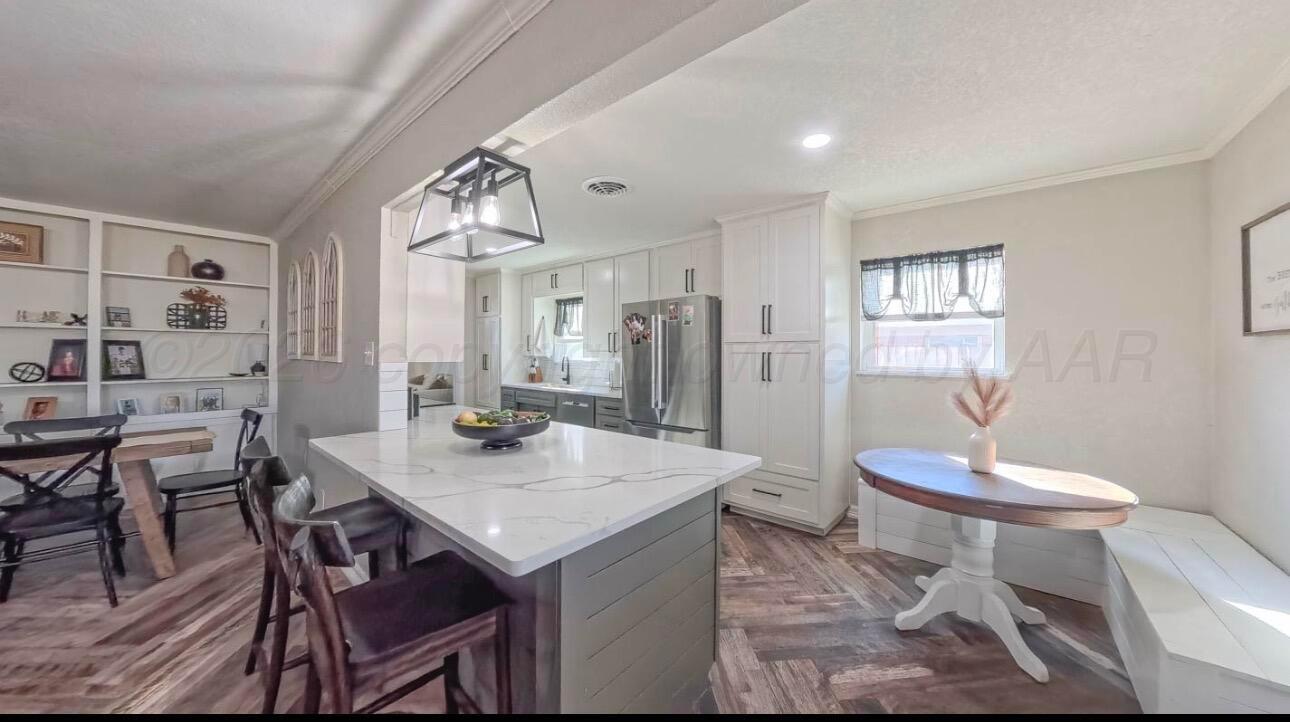 1402 Marigold Street Borger, TX 79007 - Photo 5 of 18 a view of a dining room with furniture and window