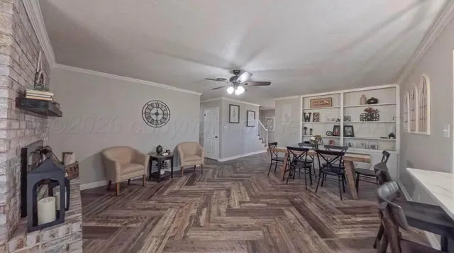 a view of a dining room with furniture and chandelier