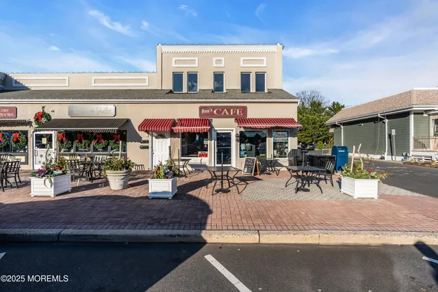a view of a cafe with sitting area